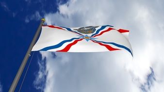 assyrian flag in the blue sky