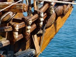 touristic boat with carved wooden statues
