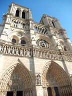 facade of notre dame de paris on a sunny day