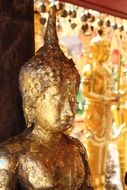 golden buddha statue close up