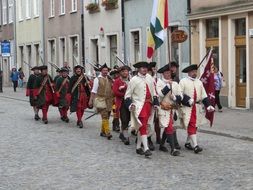 Picture of group of soldiers are walking on a road