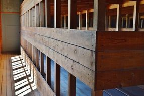 wooden beds in two tiers in a concentration camp