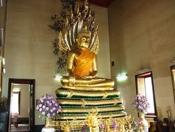 golden Buddha statue in Thai temple