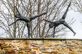 bronze statues of dancing children in England