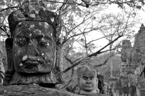 menacing stone sculptures in a cambodia temple complex