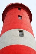 red and white lighthouse close up