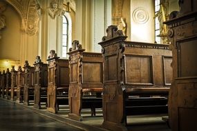 wooden benches in a christian church