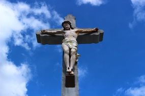 sculpture of Jesus on the stone cross