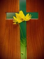 wooden cross with a yellow flower for Easter