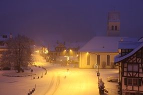 Snow covered Village at night