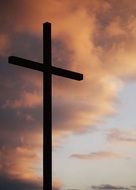 Christian cross silhouette on the evening sky