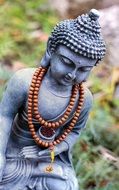 statue of gray buddha for prayer