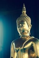 gold figure of a Buddha in Bangkok temple
