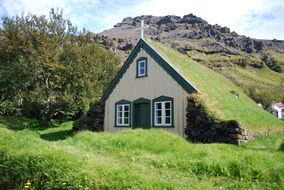 church with grass on the roof in Iceland