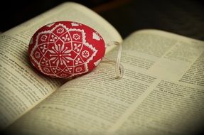 red easter egg on bible