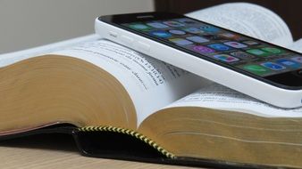 smartphone on open Bible