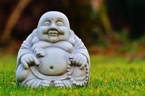 Buddha like a figure on the grass