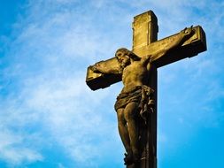 crucified jesus on the cross against the blue sky