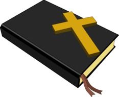 golden cross on the bible