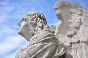 sculpture of an angel on a background of blue sky