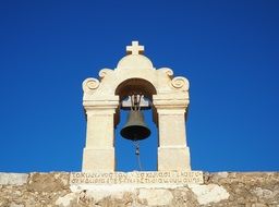 bell tower under a clear blue sky