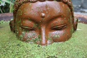 Buddha in the pond in the garden