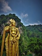 golden statue near the temple in malaysia