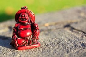 Buddha as a comic figure on a stone