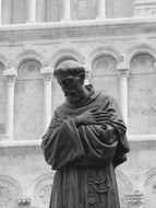 Monk statue near a church in Italy