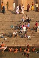 people on the steps near the ganges in Varanasi