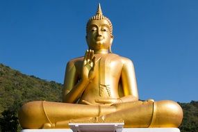 Golden Buddha statue at green mountain