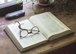 Mutilated eye glasses on the book