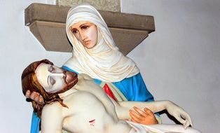 symbolism of a grieving mother in sculpture