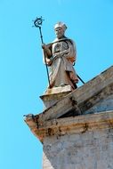 sculpture on the roof of the church on a clear day