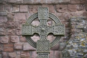 celtic cross in the graveyard