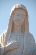 white stone statue of the Virgin Mary