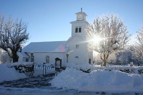 White church at sunshine in winter