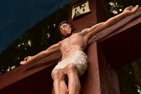 large wooden cross with crucifix close up