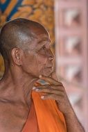 Buddhist monk in profile closeup