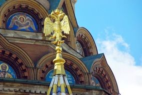 Golden double-headed eagle near the cathedral in Russia