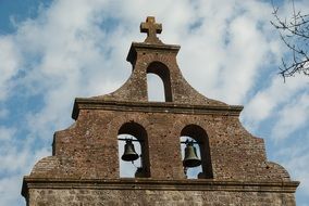 Old bell tower at sky, France