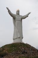 huge statue of christ on a hill in poland