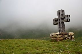 big cross on green grass at glockner road