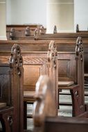 wooden benches in the interior of the church