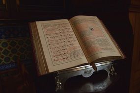 open bible on a table in a church