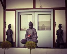 stone buddhist statues at the entrance to the temple in China