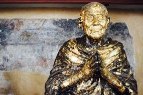 golden sculpture in a buddhist temple