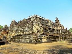 The ruins of a temple under the blue sky in Cambodia