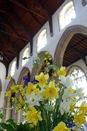 bouquet of spring Flowers in gothic Cathedral