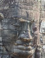 ruins with faces in a temple complex in cambodia close up
